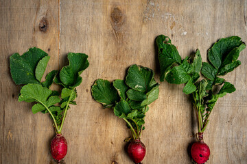 Fresh vegetables in composition on old wooden background