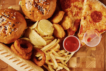 Unhealthy and junk food. Different types of fast food on the table, closeup
