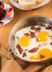 Traditional Turkish Breakfast - Fried Egg with Turkish sausage. Bread and Tea