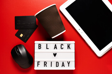 Black friday sale word on lightbox on a red background