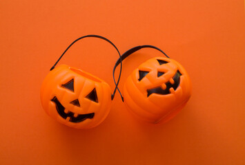 pumpkin shaped baskets with colorful background, halloween concept