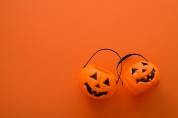 pumpkin shaped baskets with colorful background, halloween concept
