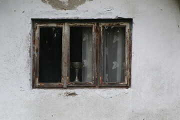 old wooden window on the abandoned house