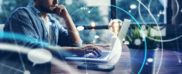 Male hands with laptop. Man working remotely at home. Concept of networking or remote work. Global business network. Online courses.