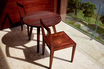 Wooden chair and table in daylight