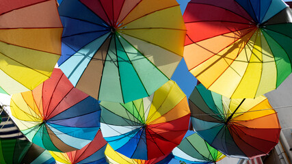 sunshade with colored umbrellas in open market place
