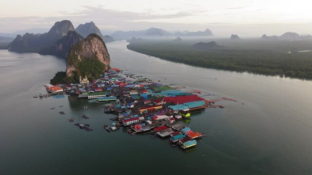 4K UHD Aerial view over Ko Panyi floating village in souther of Thailand. Ko Panyi is a fishing village in Phang Nga Province, Thailand.