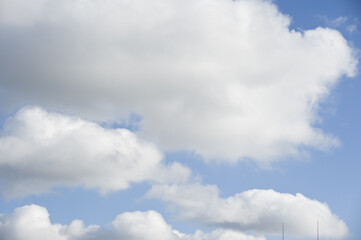 White clouds cumulus floating on blue sky for backgrounds concept
