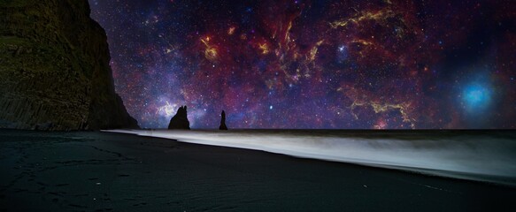 The cliffs by the township of Vik in Iceland Reynisdrangar basalt sea stacks