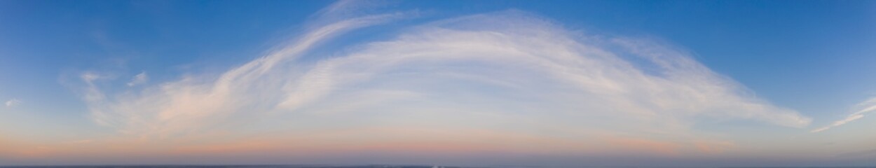 Obraz premium Colorful sky with cirrus clouds during dawn. High resolution panorama. View from above