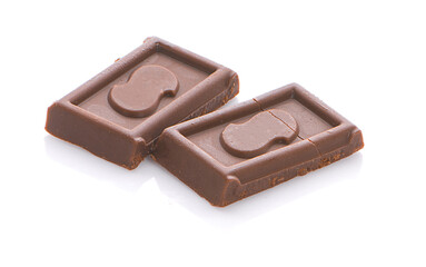 Milk chocolate pieces isolated on white background