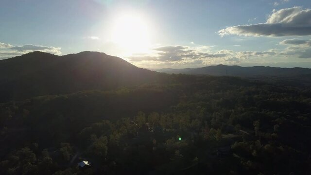 Aerial, pov, autumn landscape with a lens flare, North Carolina, USA