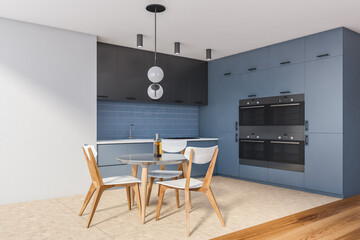 Modern white and blue kitchen corner with dining table