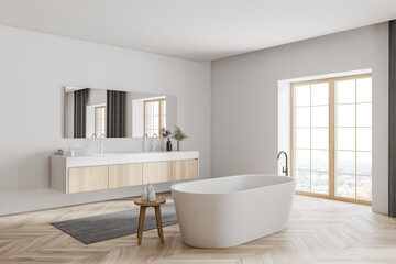 Fototapeta na wymiar Modern white and wooden bathroom corner with tub and sink