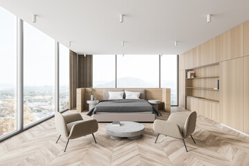 Modern wooden master bedroom interior with armchairs