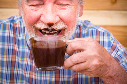 Funny Scene With Nice Senior Old Man Portrait Drinking Hot Chocolate And Having Face Dirty Of It - Mature People Have Fun Ald Laugh For Fun