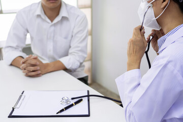 patient listening intently to doctor explaining symptoms medical informations prevention diseases and diagnosis, in medical clinic or hospital healthcare service center.