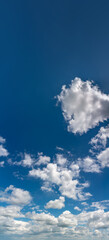 Fantastic clouds against blue sky, panorama