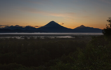 Kamchatka, a group of volcanoes at sunset