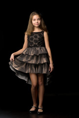 Fototapeta na wymiar Beautiful young teen girl studio photo on black background