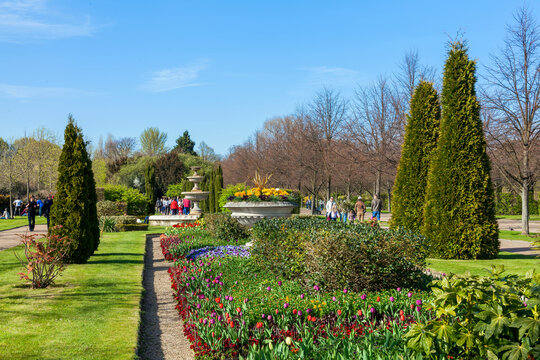 Regents Park with spring formal flower bed and urn which is a popular public open space travel destination tourist attraction landmark of the city stock photo image