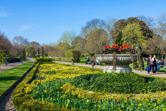 Regents Park with spring formal flower bed and urn which is a popular public open space travel destination tourist attraction landmark of the city stock photo image