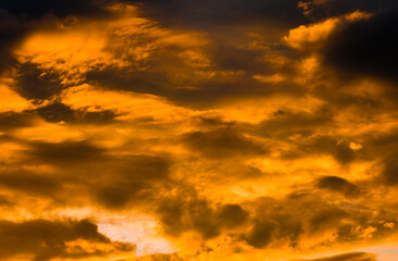Beautiful sunset. Yellow clouds in the sky (background)