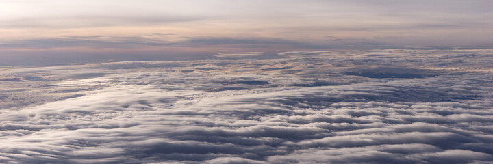 Over the clouds. Fantastic panoramic background with clouds