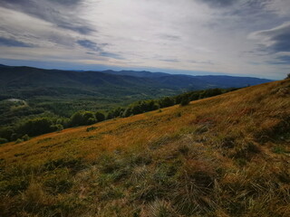 Bieszczady Poland. Carpathians European Mountains. Mountain trails in the Bieszczady Mountains. Autumn colors of the mountains. Cloudy sky.Mountains in autumn.