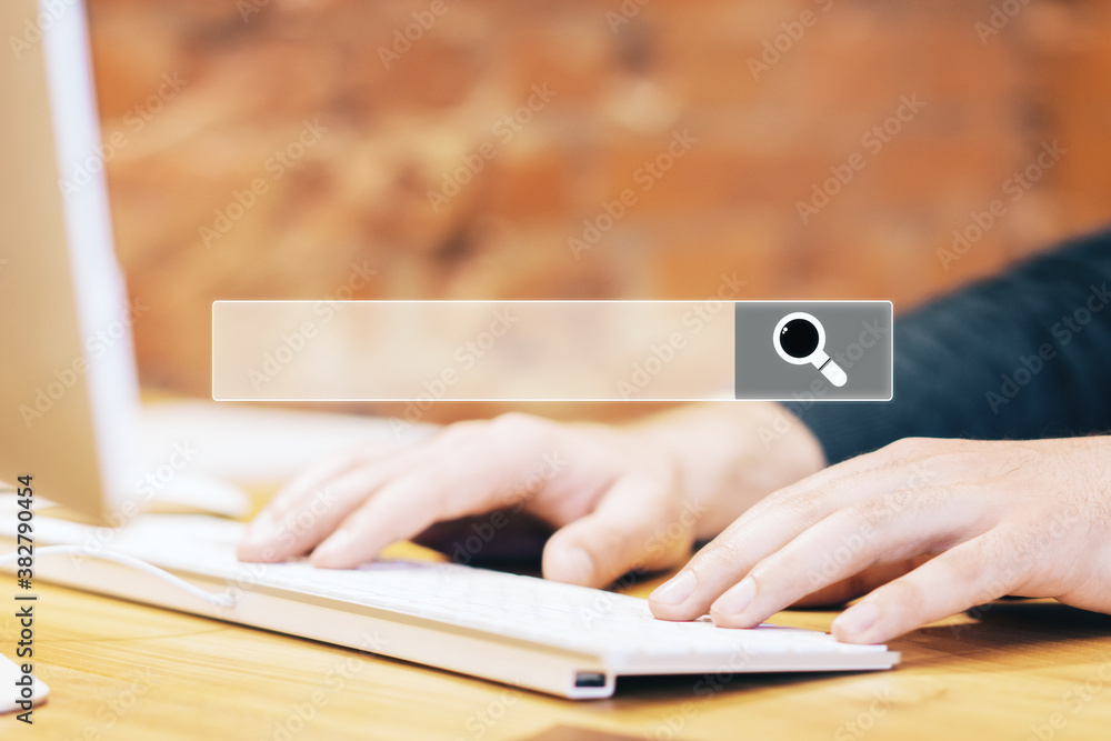 Poster Hands typing on keyboard with search bar.
