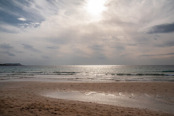 Sandy seashore against the sky.