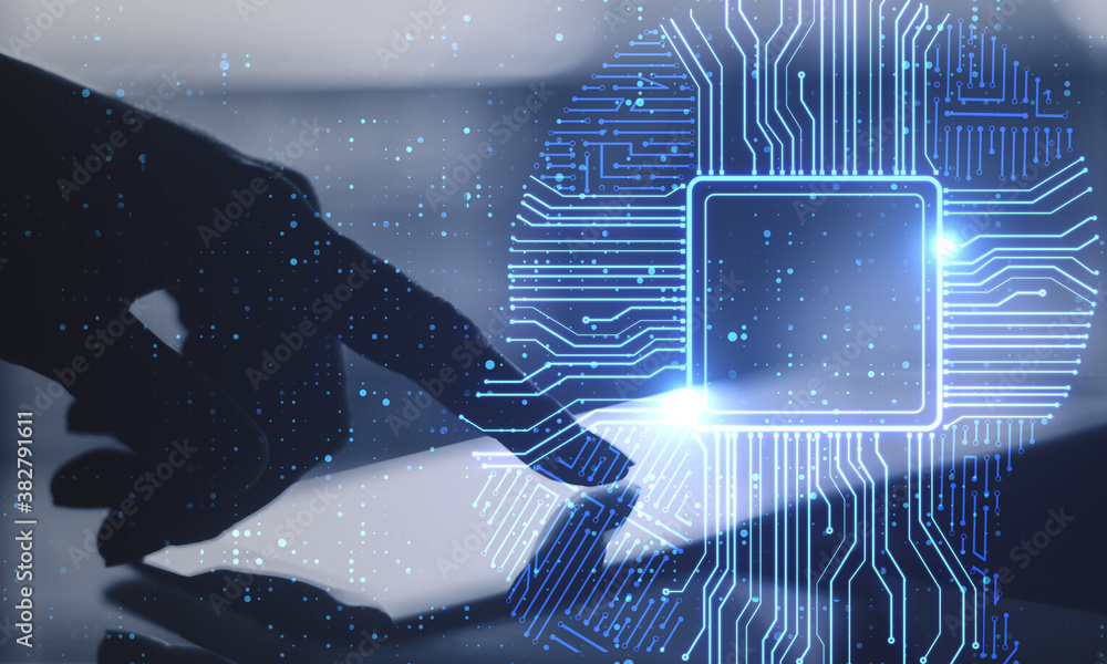 Poster Hand using tablet computer with creative glowing digital chip interface.
