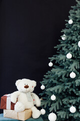 Christmas tree pine New Year's decor interior room with gifts black background