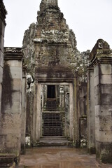 Ruined stone door in a cambodian temple
