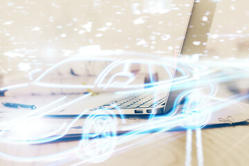 Desktop computer background in office with automobile hologram drawing. Multi exposure. Tech concept.