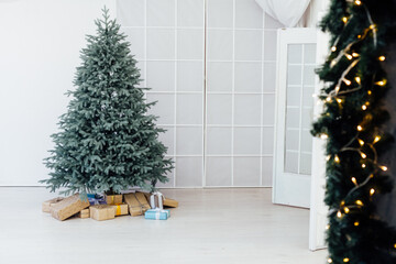 Christmas tree blue pine with gifts interior decor white room new year winter holiday