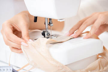 Lingerie tailor workstation, Automatic sewing machine with fabric and thread