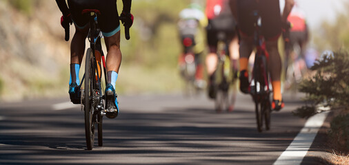Fototapeta na wymiar Cycling competition, cyclist athletes riding a race