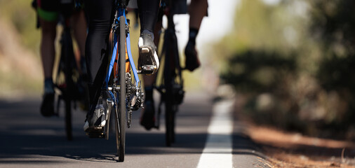 Fototapeta na wymiar Cycling competition, cyclist athletes riding a race