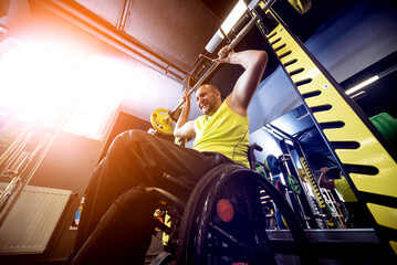 Naklejka premium Disabled man training in the gym of rehabilitation center
