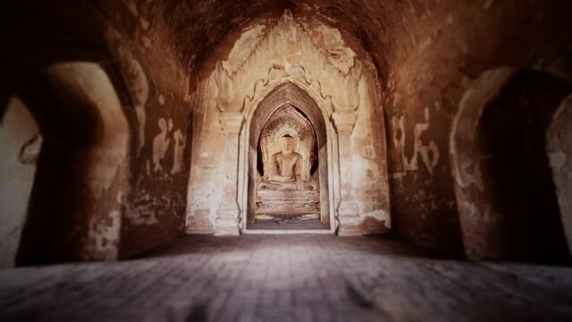 statue of sitting Buddha inside an untitled simple temple in Bagan Myanmar