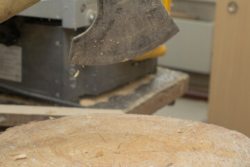 the axe is stuck in the stump. cutting wood. men's work. High quality photo