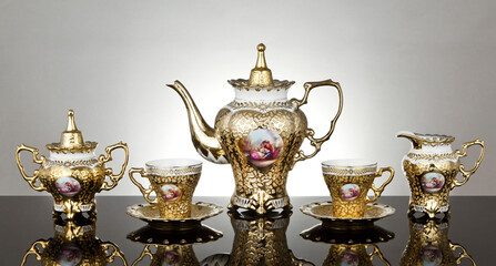 Delicate golden porcelain on Dramatic modern background