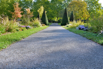 close ona footpath in gravel crossing a beautiful public park landscaped