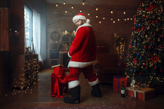 Bad drunk Santa claus pee on gifts