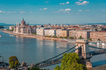 Obraz premium The panorama view of the skyline in Budapest, Hungary, with Széchenyi Lánchíd over the Danube, and the parliament building in Hungary.