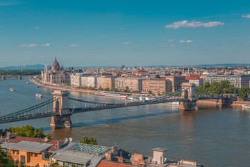 Obraz premium The panorama view of the skyline in Budapest, Hungary, with Széchenyi Lánchíd over the Danube, and the parliament building in Hungary.