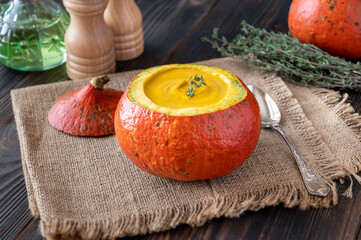 Pumpkin soup served in hokkaido pumpkin