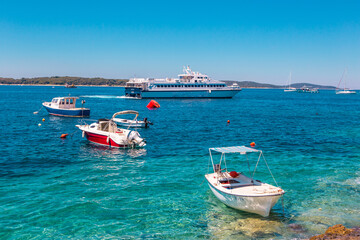 The old harbour at Hvar island, at the coast of Croatia, on a sunny day, summer time.