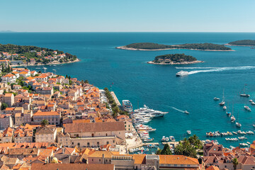 Obraz premium The old harbour at Hvar island, at the coast of Croatia, on a sunny day, summer time.